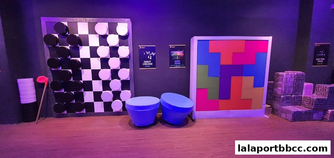 A room with giant games including checkers, Tetris, and an electric maze.