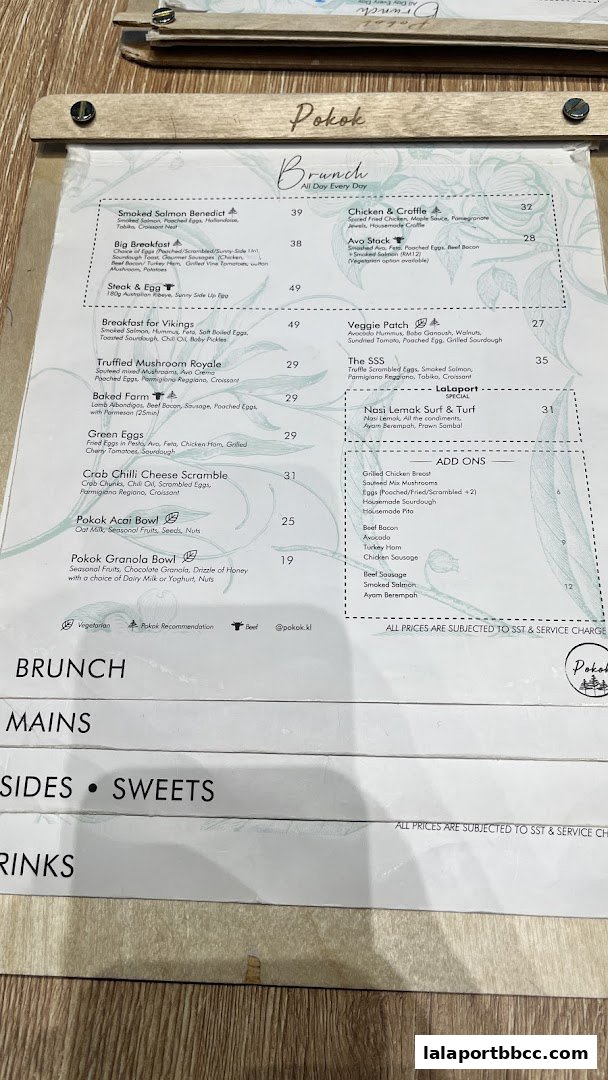 A menu from POKOK LaLaport featuring brunch items like Smoked Salmon Benedict and Big Breakfast.