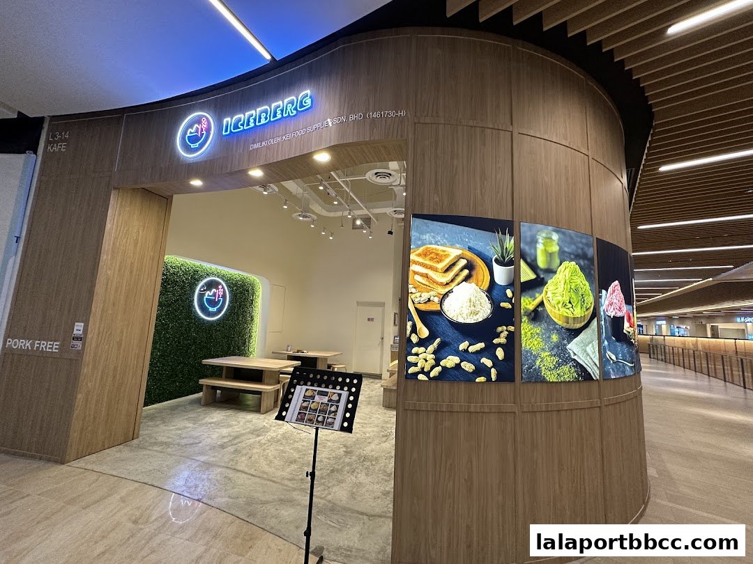 The entrance to Iceberg LaLaport, a dessert cafe with a modern design and appealing food displays.