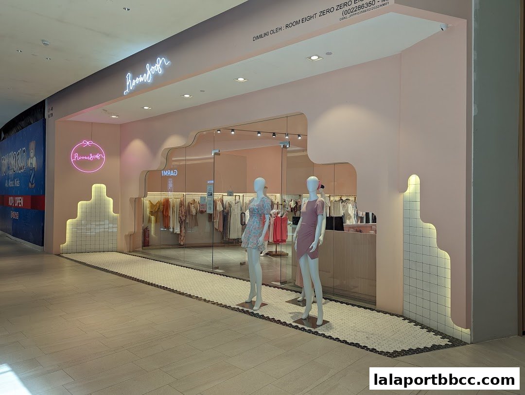 The stylish entrance of Room 8008 LaLaport, featuring mannequins and a curated clothing display.