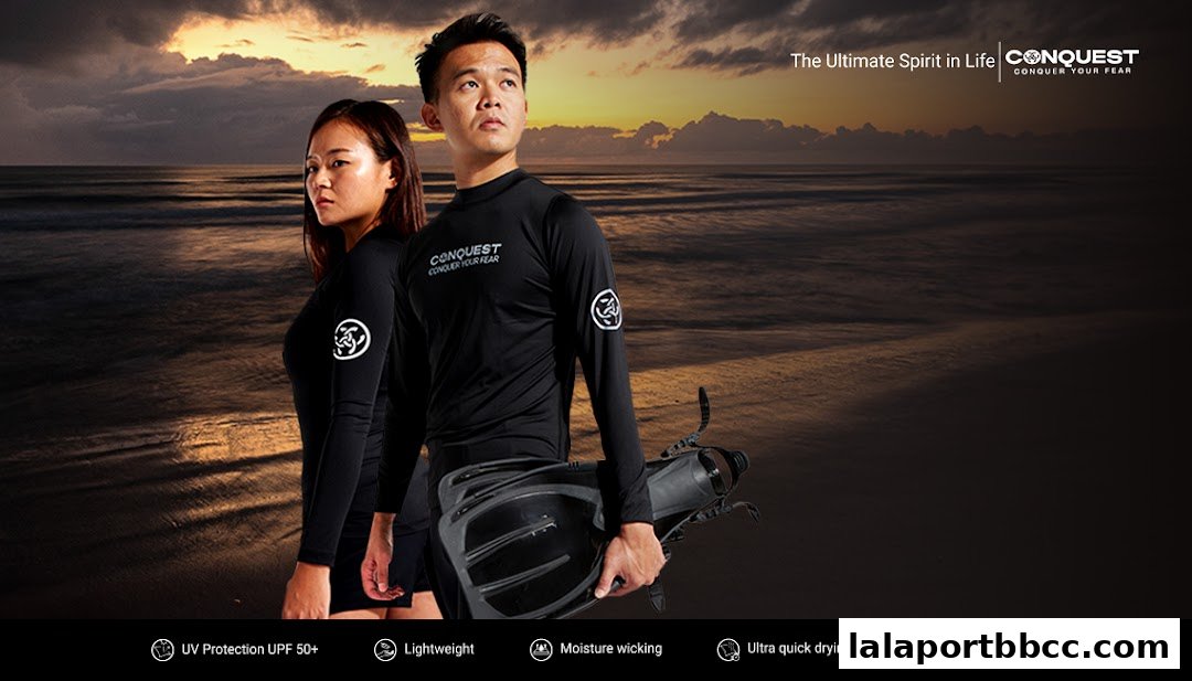 Models wearing CONQUEST apparel on a beach at sunset, showcasing product features.