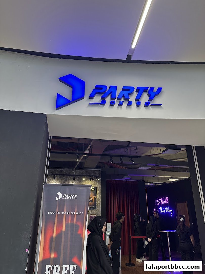 The entrance to Party Box, a retail store, with its prominent blue logo and signage.