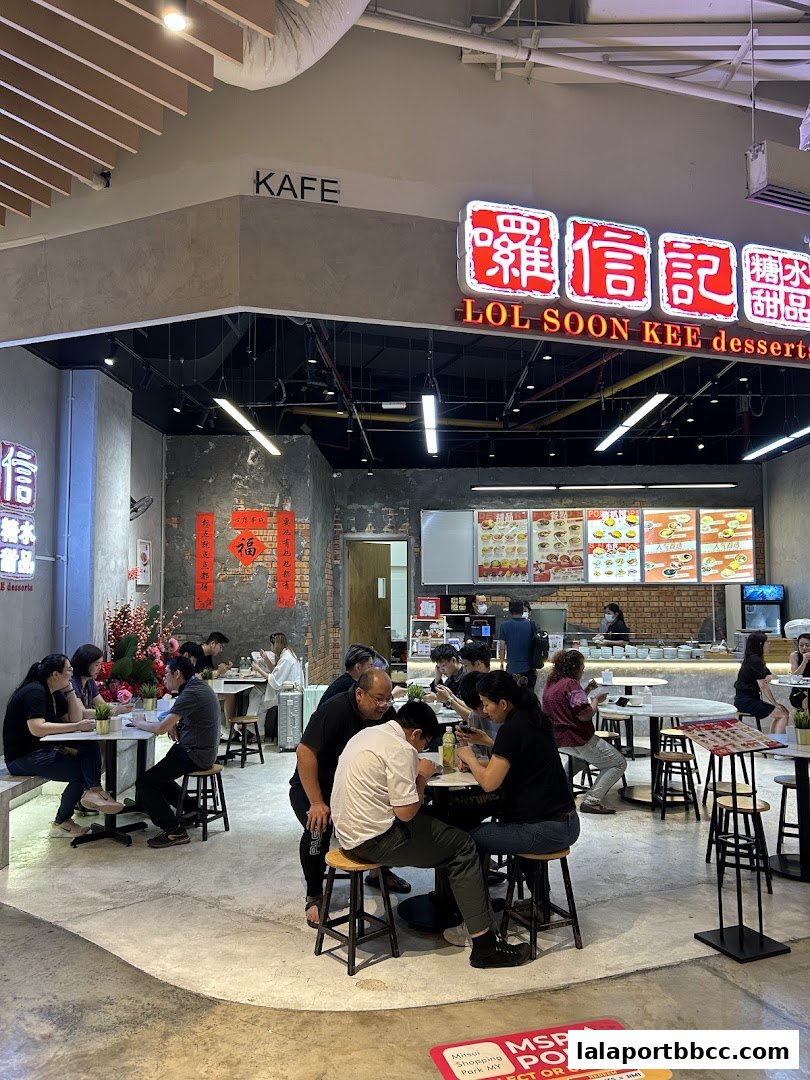 Customers dine at Lol Soon Kee Desserts, a popular dessert shop with a vibrant interior.