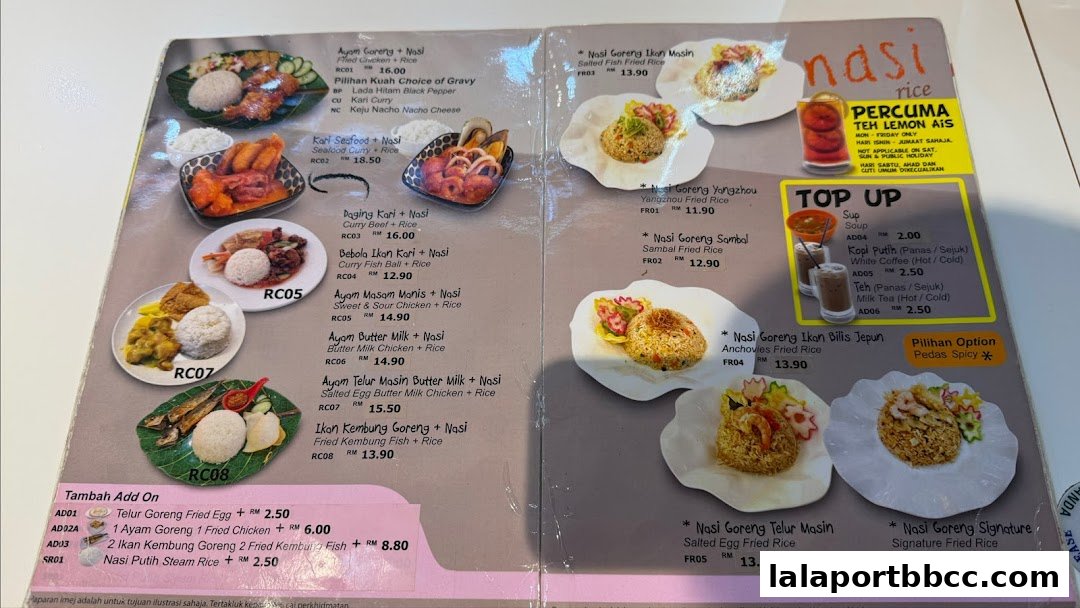 A menu from Restorant Syok Makan featuring various rice dishes and add-ons.