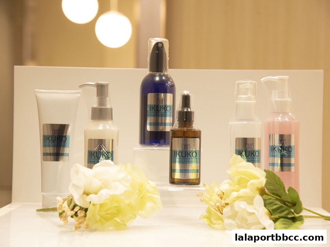 A display of IKUKO JAPAN BEAUTY skincare products with floral decorations.