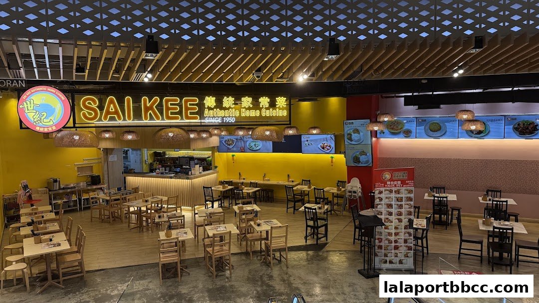 Interior view of Sai Kee Restaurant, showcasing dining tables and the restaurant's signage.