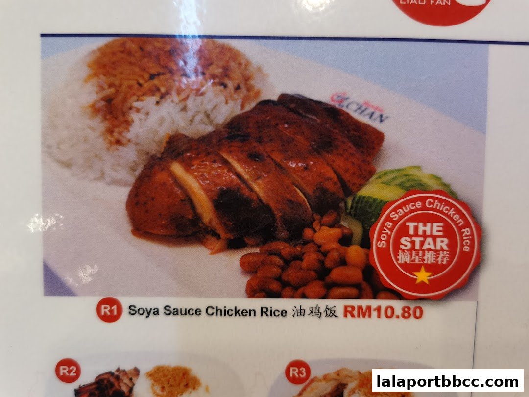 A plate of Soya Sauce Chicken Rice with beans and cucumber, priced at RM10.80.