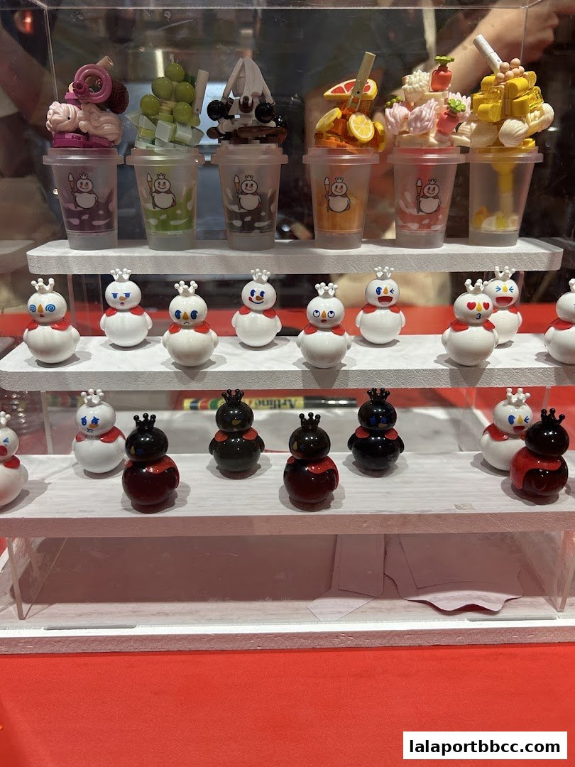 A display of colorful ice cream and cute snowmen figures at MIXUE.