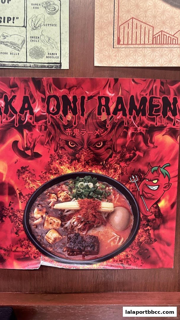 A fiery advertisement for 'Ka Oni Ramen' featuring a bowl of ramen and a devilish chili character.