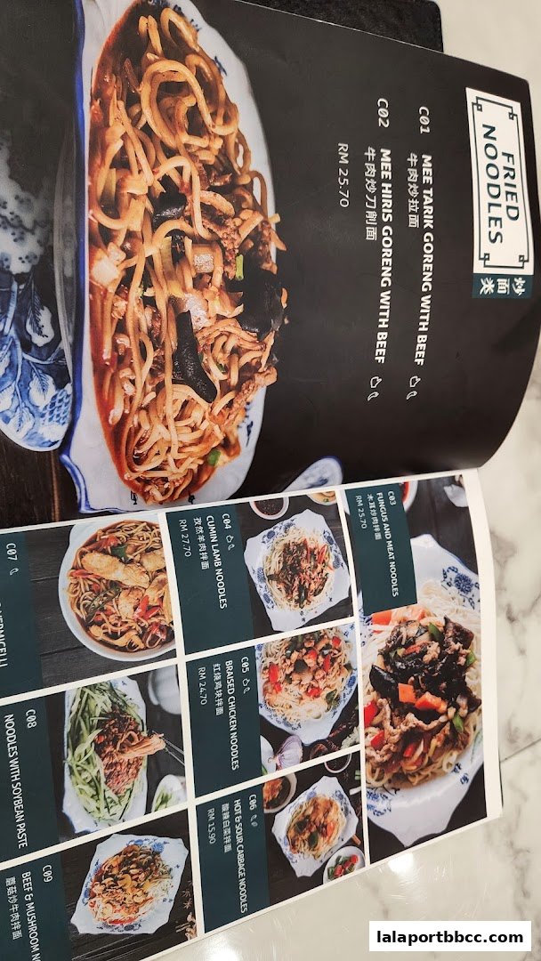 A menu featuring various noodle dishes with images and prices.