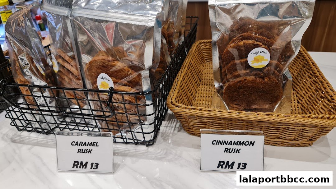 Packaged rusks, Caramel and Cinnamon flavors, displayed in baskets with price tags.