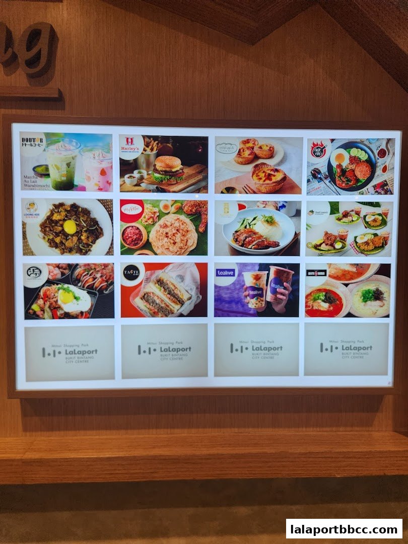 A digital display showcasing various food and drink items from different vendors.