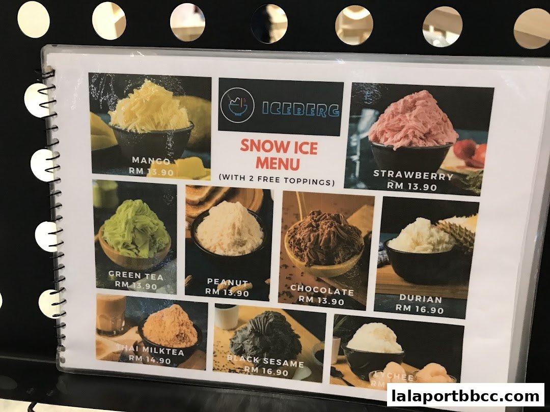 A menu for Iceberg Snow Ice featuring various flavors like Mango, Strawberry, and Durian.