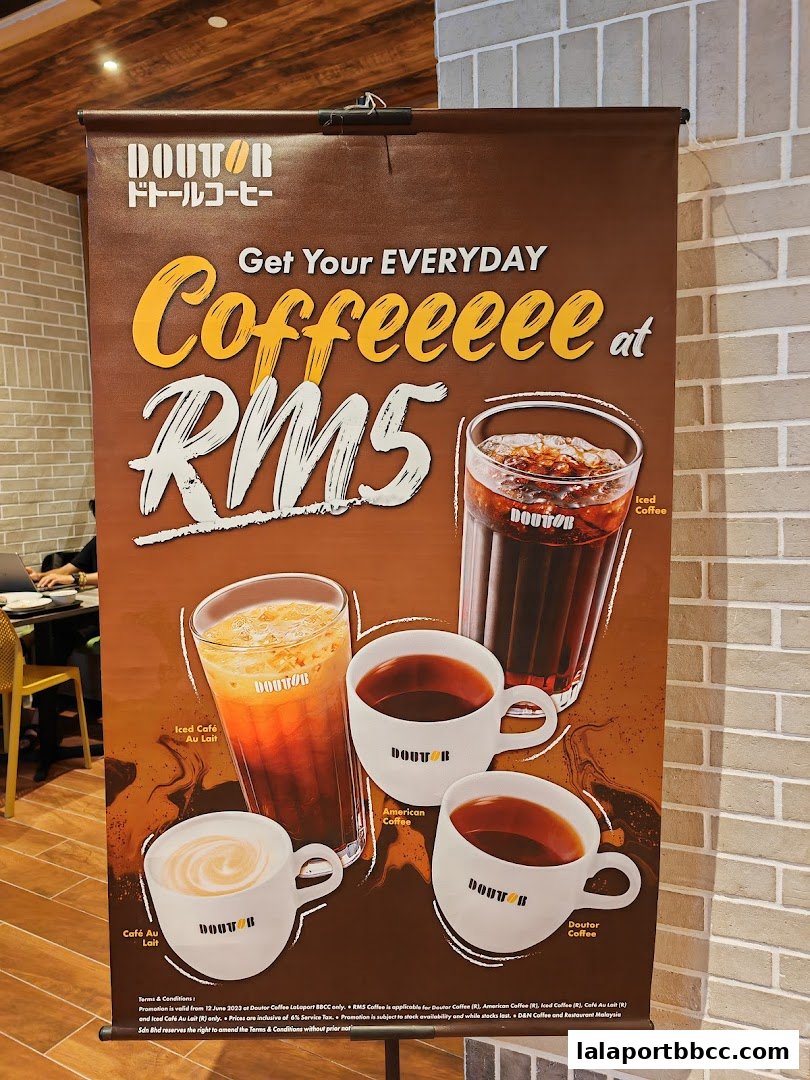 A promotional banner for Doutor Coffee featuring various coffee drinks priced at RM5.