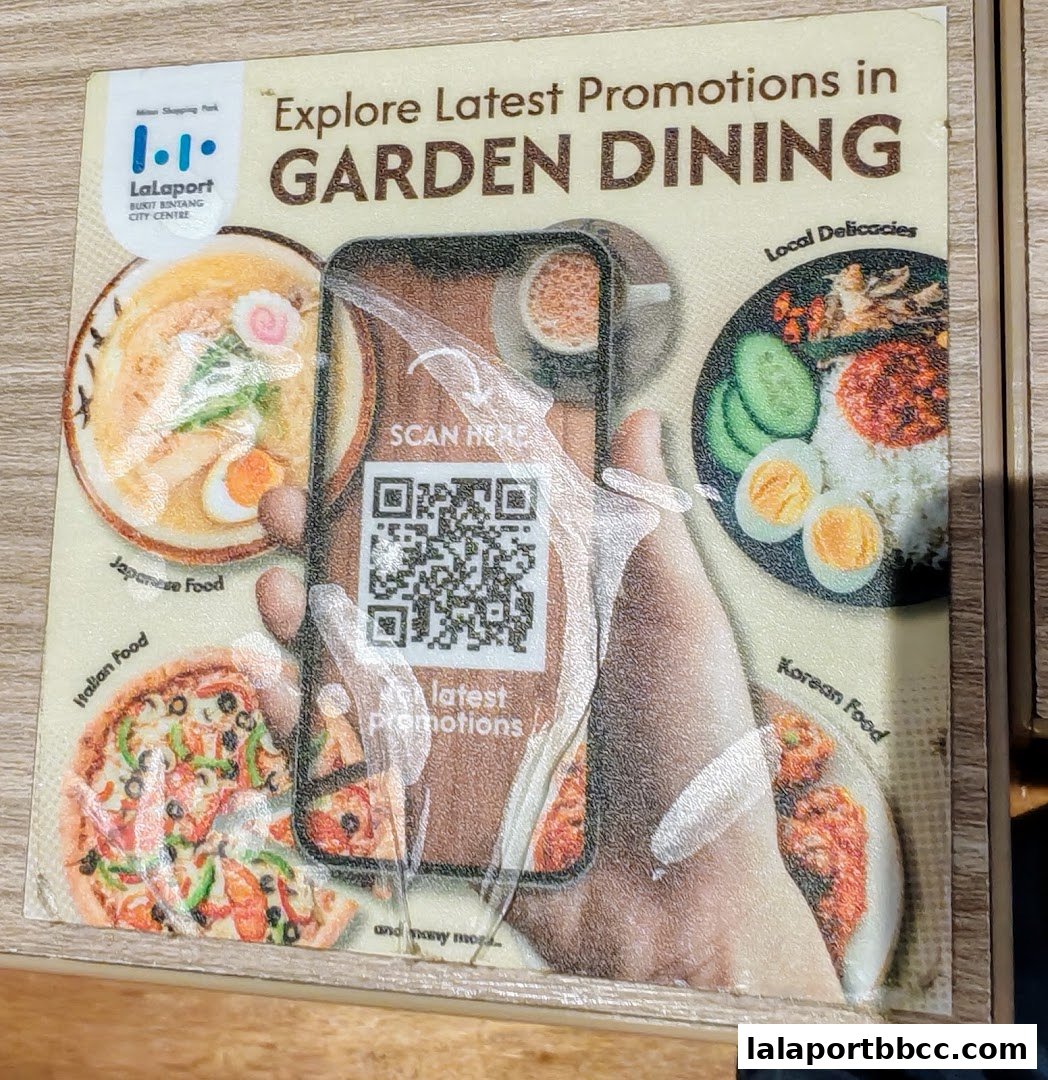 A sign promoting latest promotions in Garden Dining with various food images and a QR code.