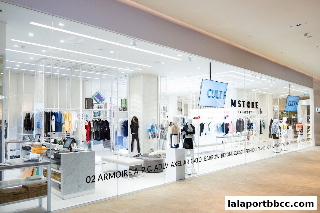 The exterior of a modern clothing store with mannequins and apparel displayed.