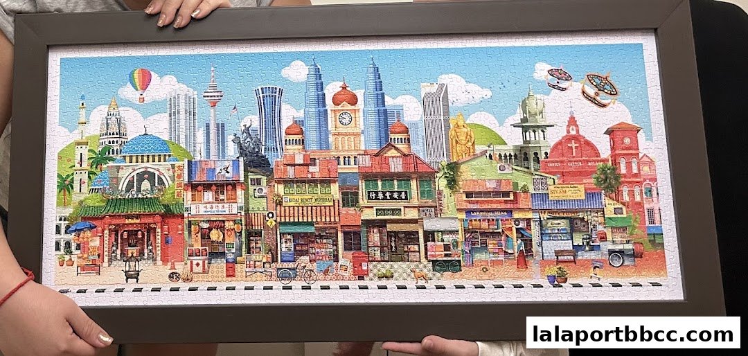 A framed jigsaw puzzle depicting a vibrant cityscape with various buildings and landmarks.