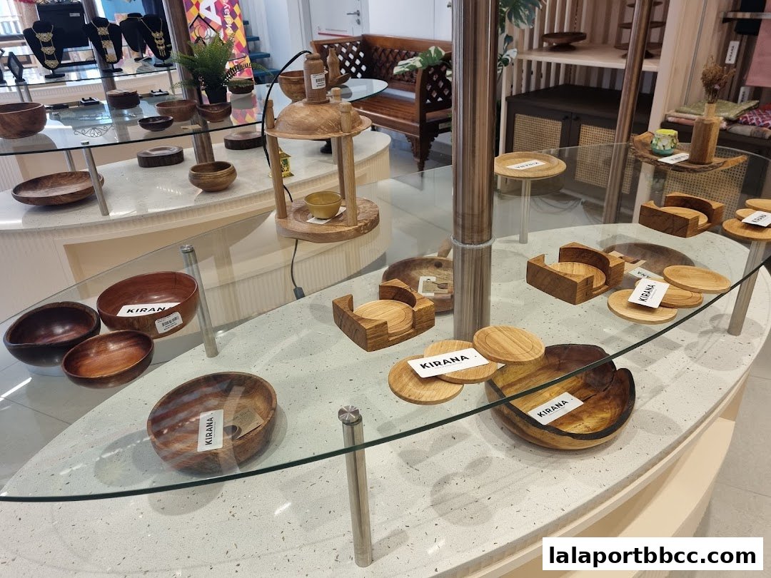 A display of wooden bowls, coasters, and other home decor items in a retail store.