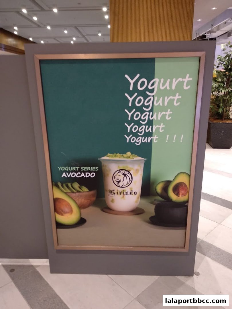 A poster advertising Kirindo's avocado yogurt drink with fresh avocados.