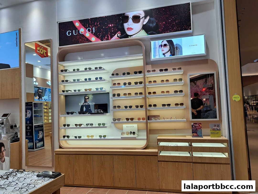 A well-lit display of various sunglasses and eyeglasses in a modern retail store.