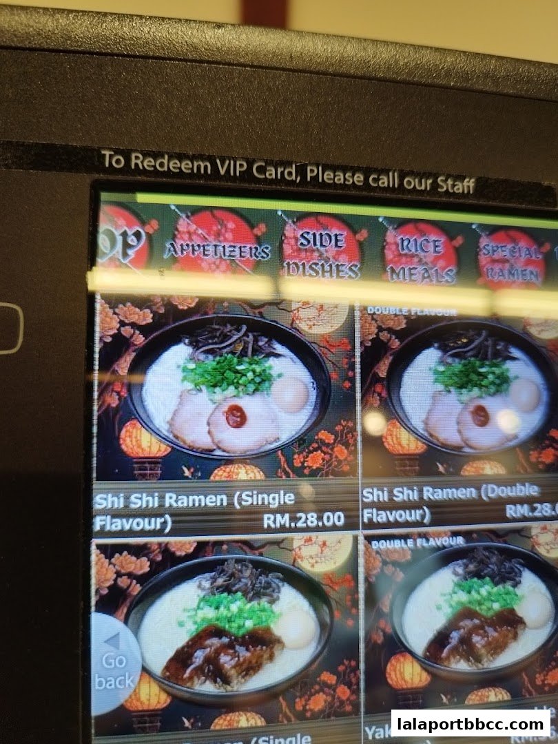 A digital menu displaying various ramen dishes with prices and images.