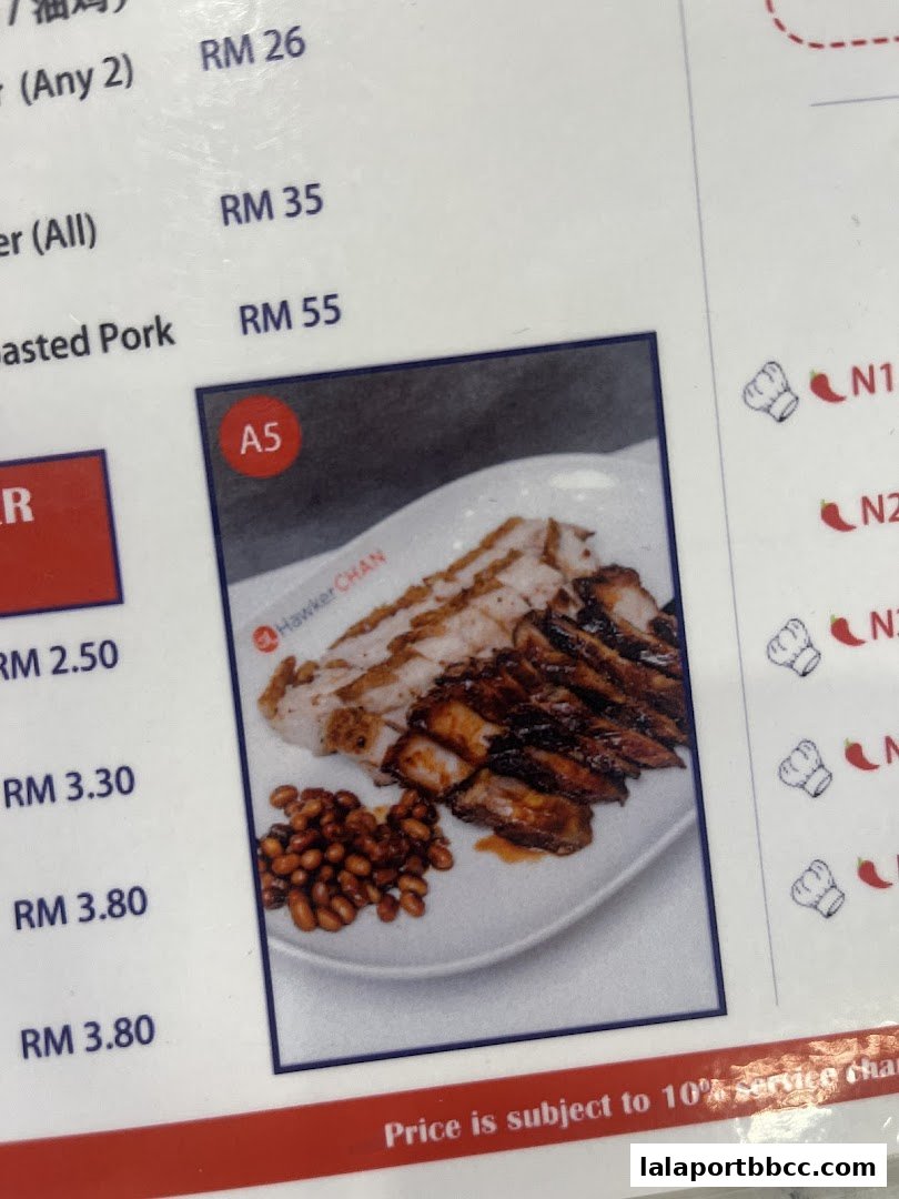 A close-up of a menu featuring roasted pork and other dishes with prices.