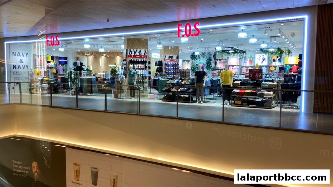 The F.O.S clothing store features a well-lit interior with mannequins displaying apparel and shelves stocked with folded clothes.