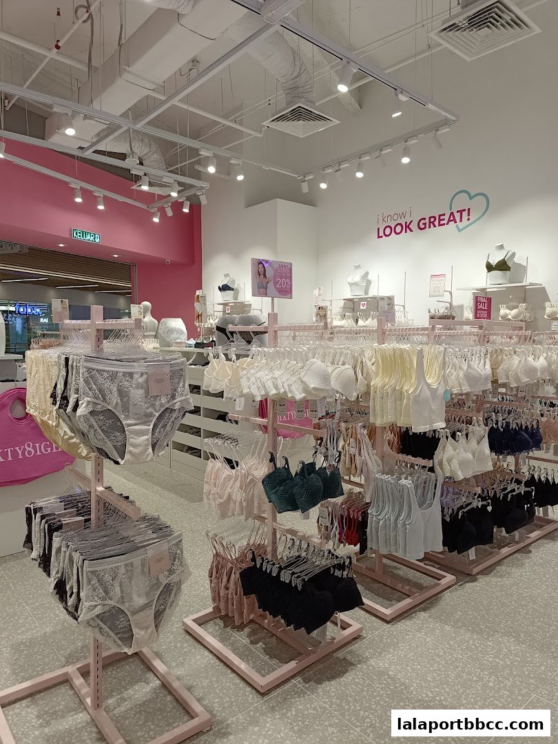 Interior view of a lingerie shop displaying bras and underwear on racks.