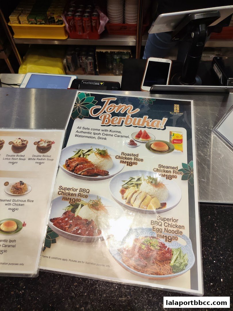 A menu from Nam Heong Chicken Rice featuring various chicken rice dishes and noodles.