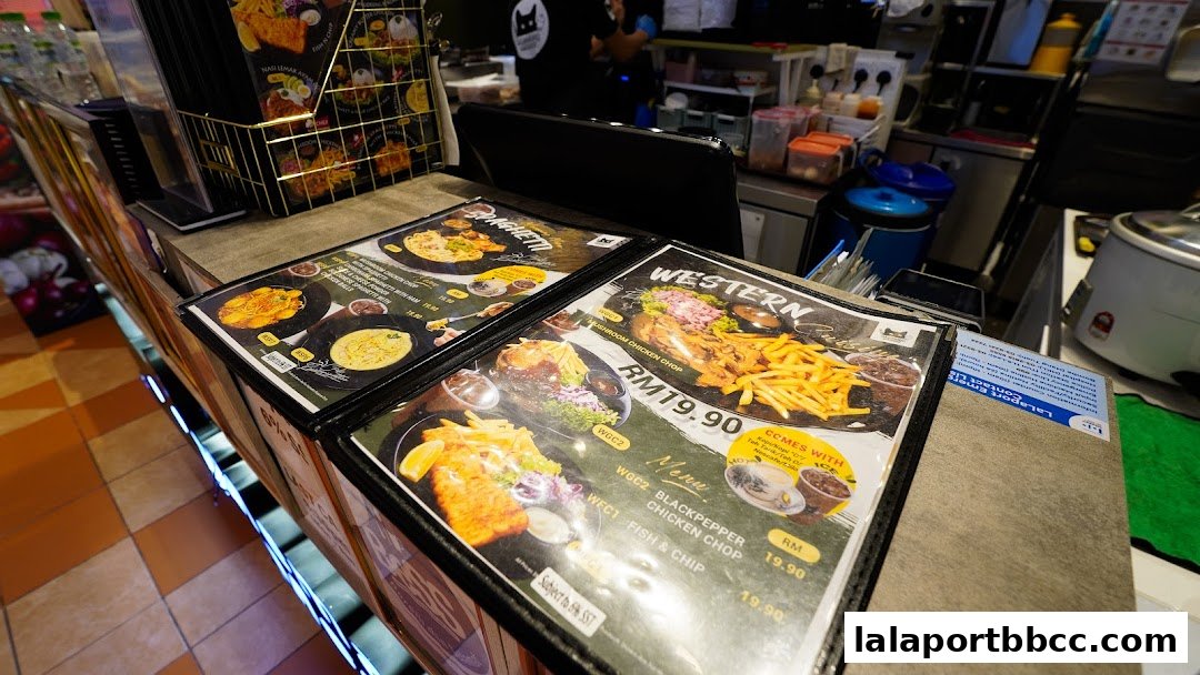 Menus displaying Western and Spaghetti dishes at Memang Meow LaLaport Bukit Bintang.
