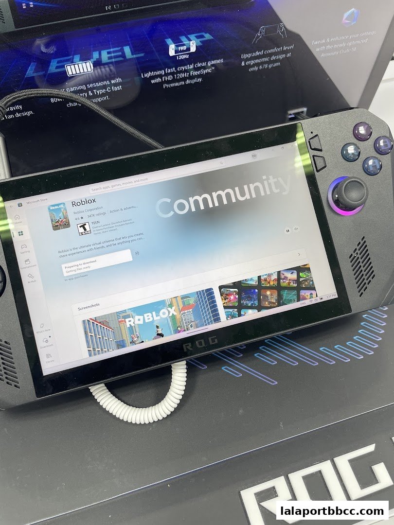 A handheld gaming device displaying the Roblox app on its screen.