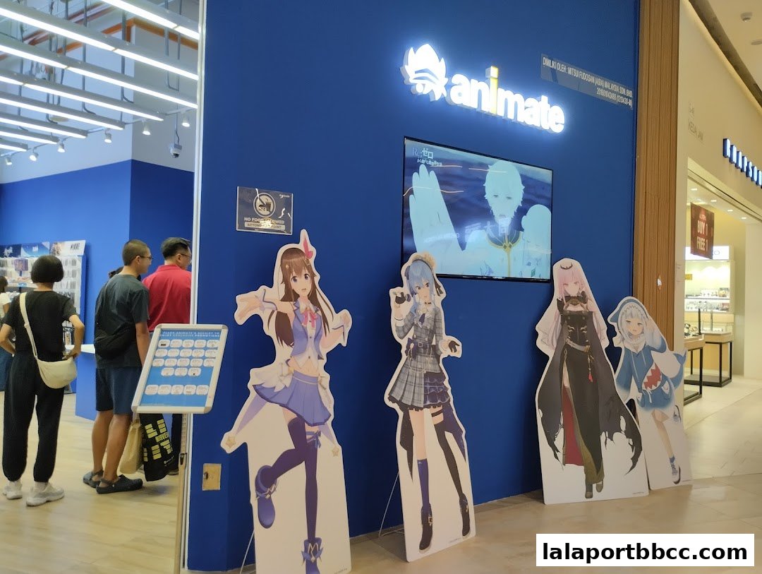 Animate store entrance with anime character cutouts and a promotional display.