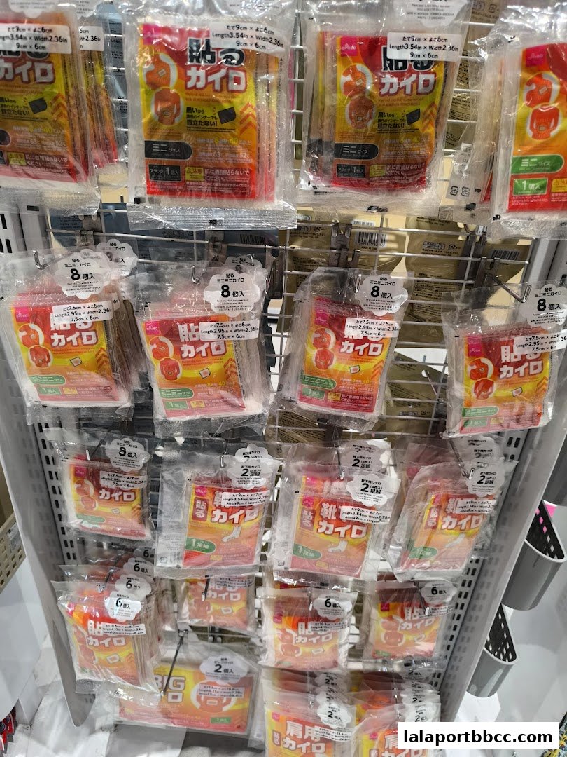 A display of various heat packs, commonly known as 'kairo', in clear plastic packaging.