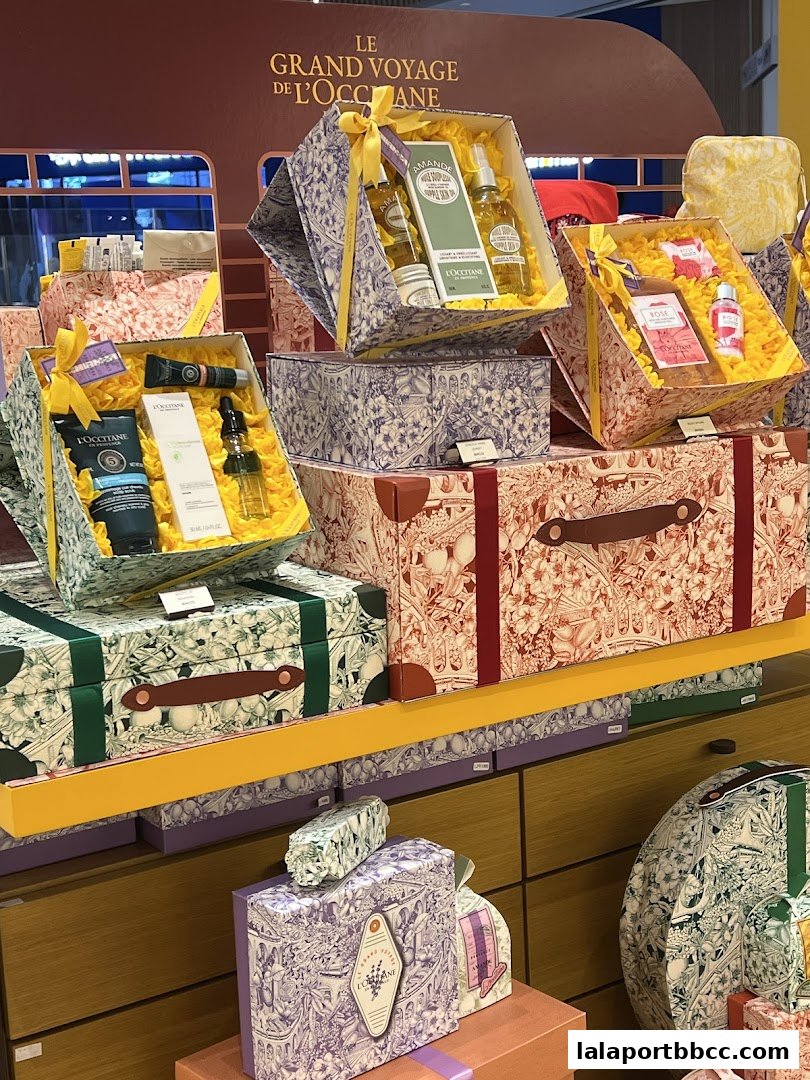 Beautifully packaged L'Occitane gift sets displayed in a retail store.