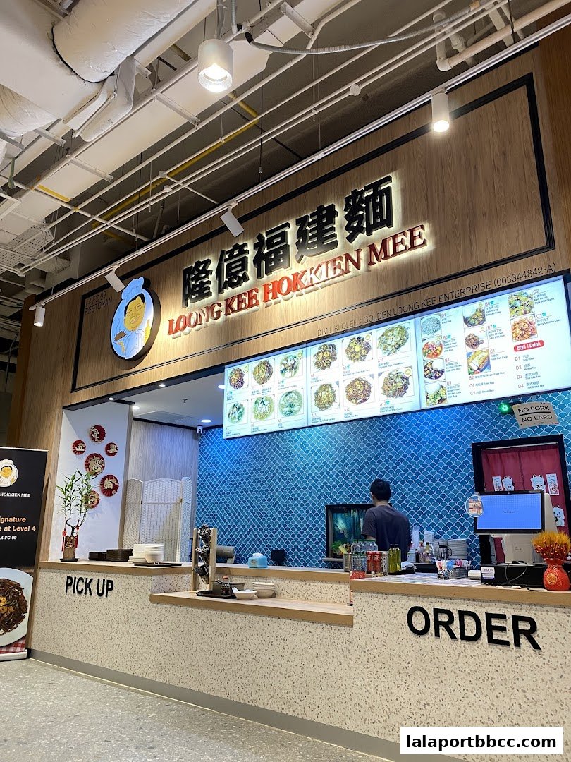 The Loong Kee Hokkien Mee shop counter with a menu board and ordering area.