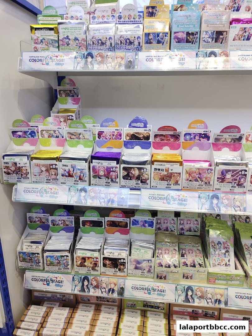 Shelves filled with merchandise featuring anime characters, primarily from Hatsune Miku: Colorful Stage!
