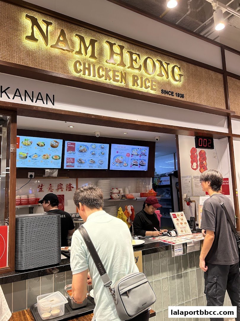 Customers ordering at the counter of Nam Heong Chicken Rice, a restaurant established in 1938.