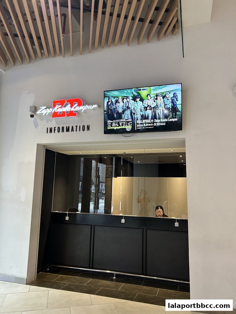 The Zepp Kuala Lumpur information counter with a promotional screen displaying an event.