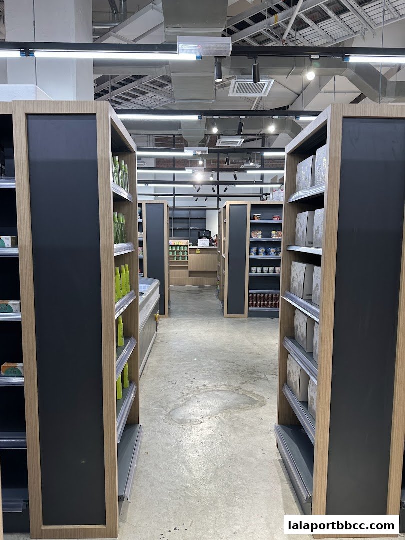 Interior view of a grocery store with aisles of shelves stocked with products.