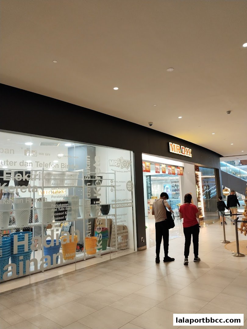 The exterior of a MR.DIY PLUS store with a display of home goods and accessories.