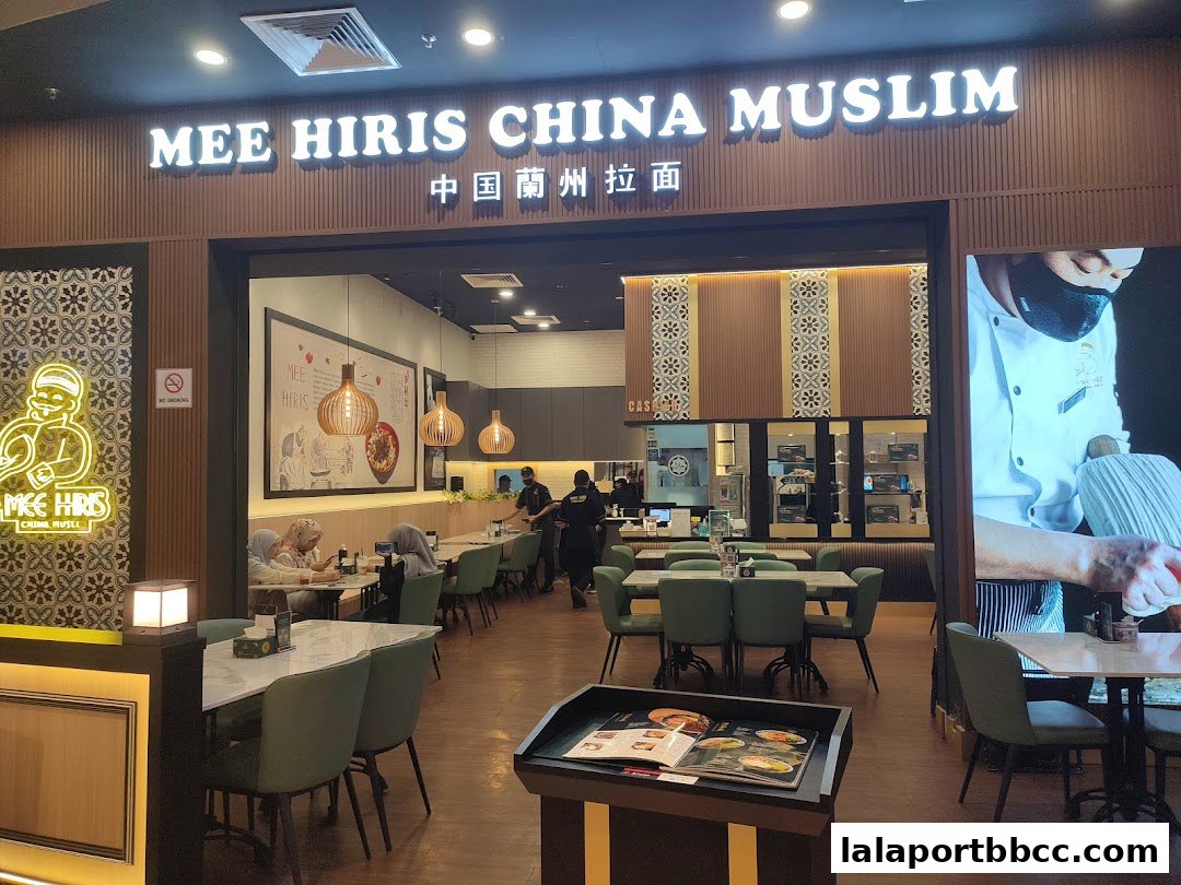 The exterior of Mee Hiris China Muslim restaurant with seating visible inside.