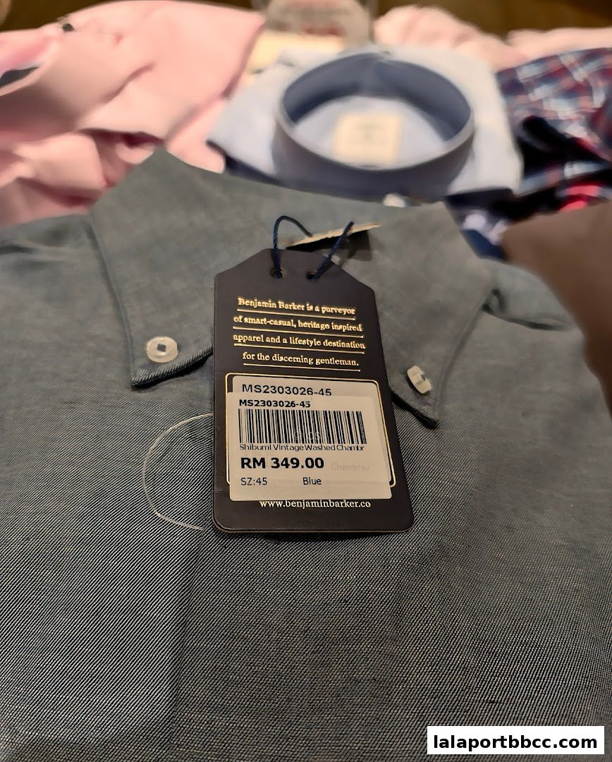 A close-up of a blue denim shirt with a price tag from Benjamin Barker.