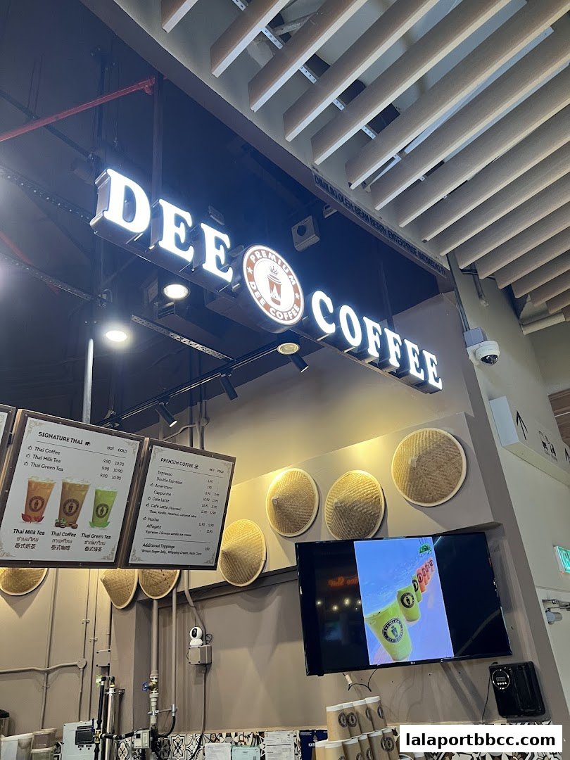 The Dee Coffee shop sign and menu boards are displayed prominently.
