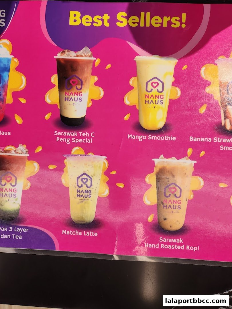 A colorful menu board showcasing various popular drinks from Nang Haus.