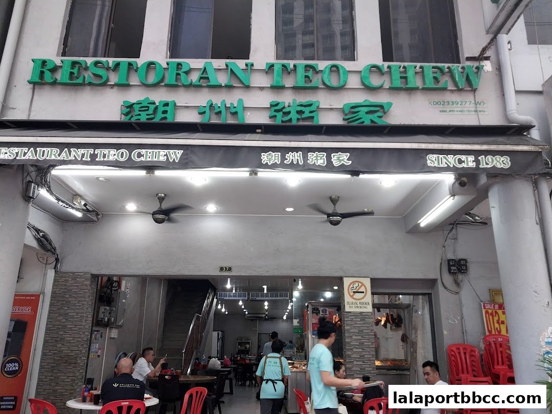The exterior of Restoran Teo Chew, a restaurant established in 1983, with visible signage and seating.