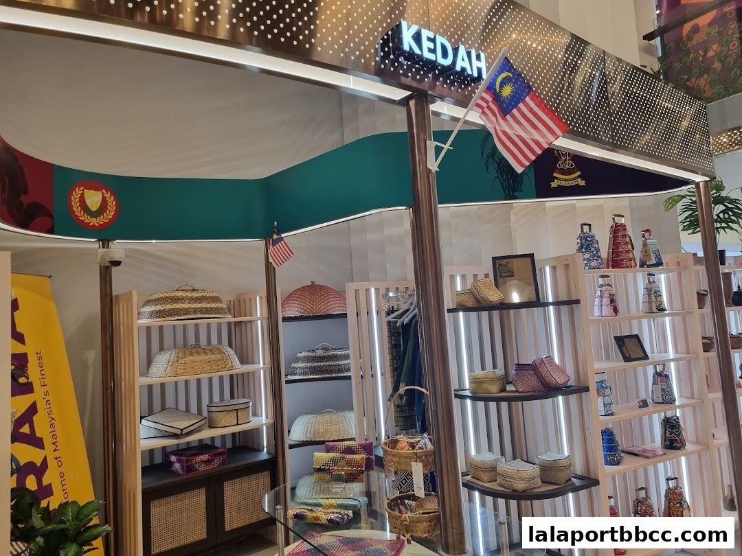 A retail display featuring Malaysian handicrafts, including woven baskets and decorative items.