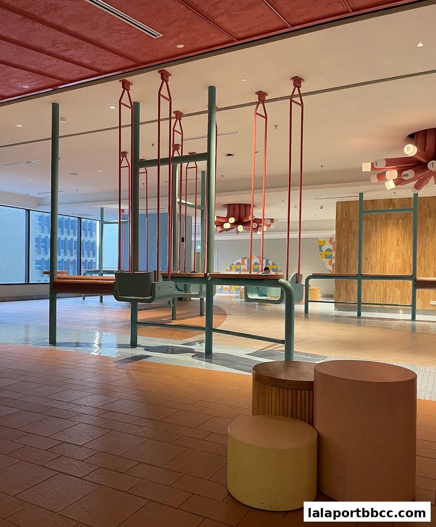 Interior view of a modern, colorful space with unique seating and lighting fixtures.