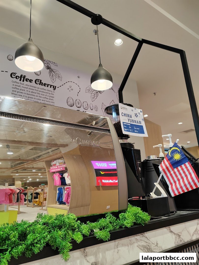 A coffee machine with a Malaysian flag and a sign indicating Yunnan coffee beans.