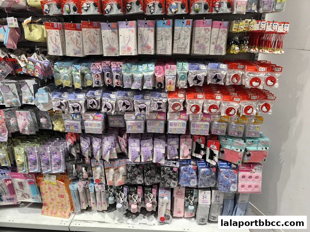 A wall display of various cute character-themed merchandise, including keychains, pouches, and accessories.