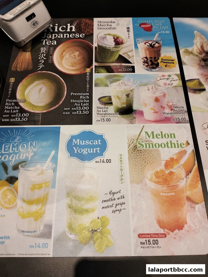 A menu featuring various coffee and tea drinks, including matcha, yogurt, and fruit smoothies.